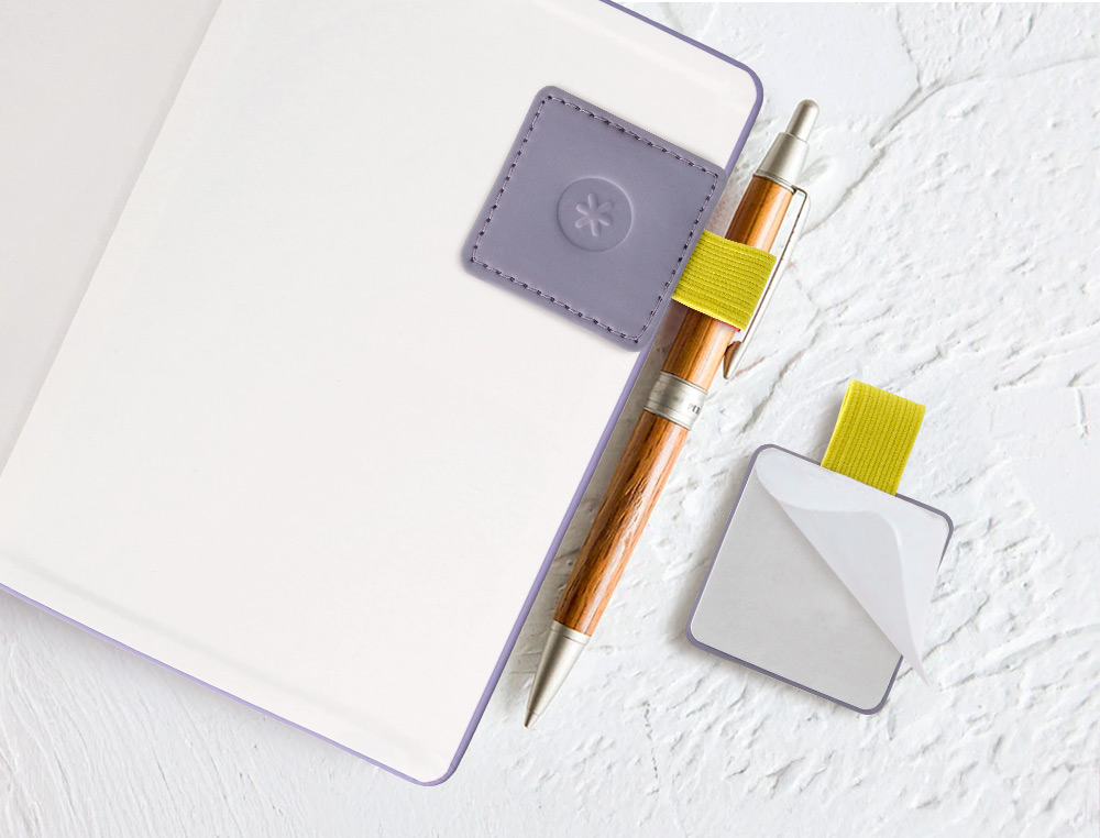 PORTABOLIGRAFO AUTOADHESIVO ANTARTIK PARA CUADERNO NOTE CON ELASTICO HASTA 15 MM GROSOR 1MM MORADO Y AMARILLO